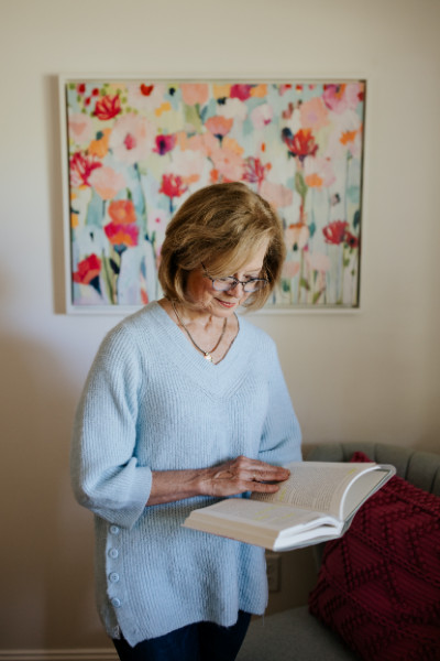 Trauma Informed Grand Rapids - Ginny reading a book